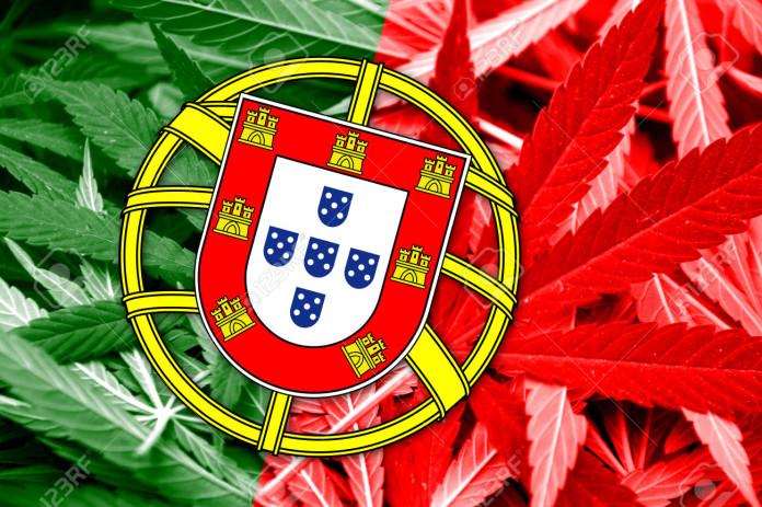 Portugal Flag on cannabis background. Drug policy. Legalization of marijuana